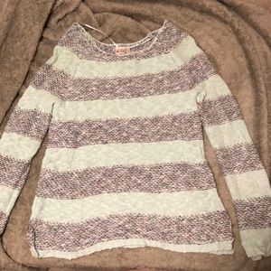 A grey and aqua colored stripped sweater